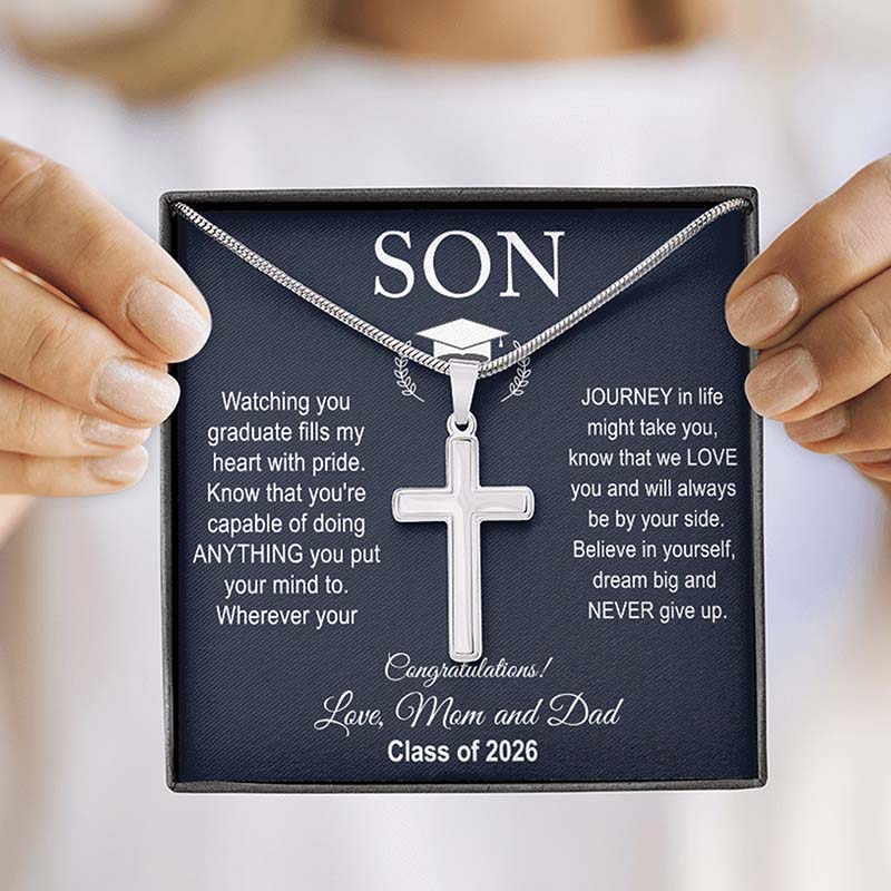 Sentimental graduation gifts for son necklace with cross pendant and graduation cap on a card held by hands