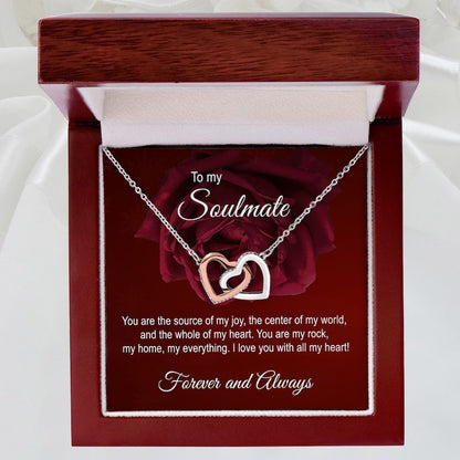 Soulmate Necklace with interlocking hearts in a wooden box with a romantic message.
