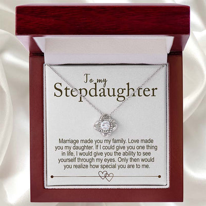 Necklace in a wooden box with a sentimental message for stepdaughter on a white satin background