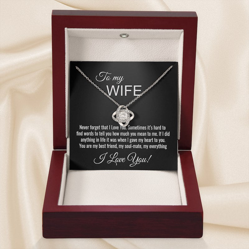 Knot necklace silver featuring a round cut cubic zirconia stone centered in a jewelry box with a sentimental message card for a wife.