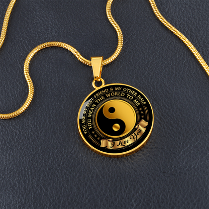 Yin Yang Gold and black pendant necklace on a dark background with sentimental message.
