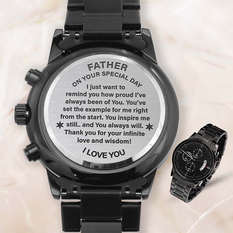 fathers day gift watches: a black analog watch shown from the back with a silver engraved message for Father's Day, alongside a smaller inset view of the watch from the front on a light marble background.