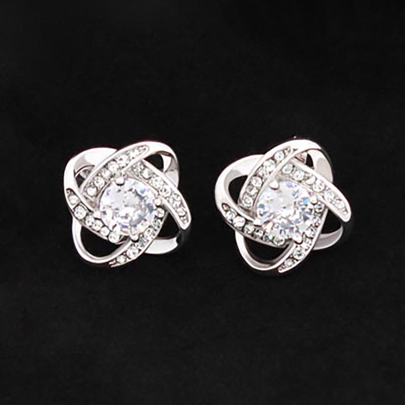 Close-up of a silver knot stud earrings, indicating the product is a replacement attachment for jewelry making.