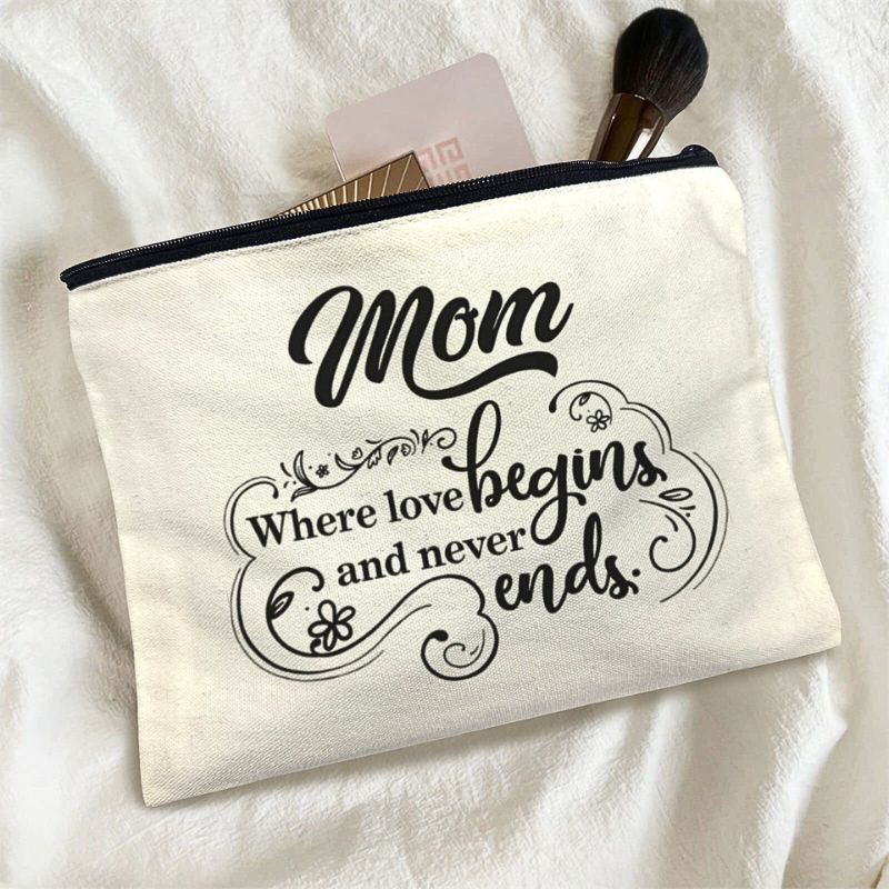 Canvas pouch with 'Mom Where love begins and never ends' text on a white background.