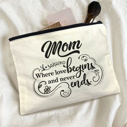 Canvas pouch with 'Mom Where love begins and never ends' text on a white background.