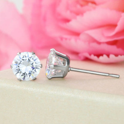 14K white gold dipped cubic zirconia stud earrings in a silver setting.
